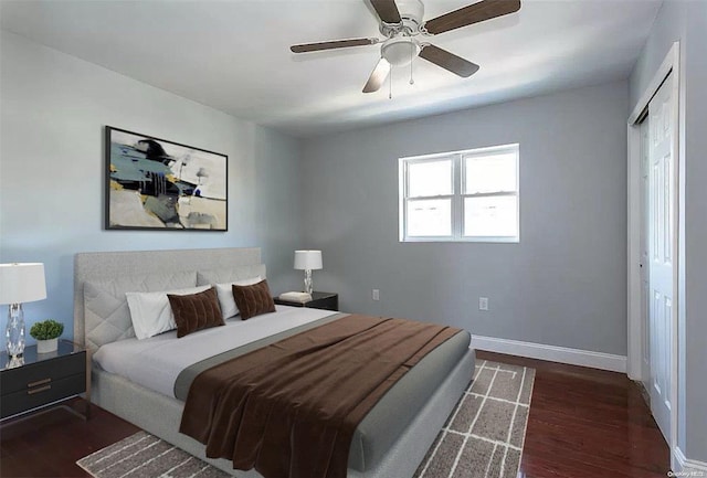 bedroom featuring ceiling fan, dark hardwood / wood-style flooring, and a closet