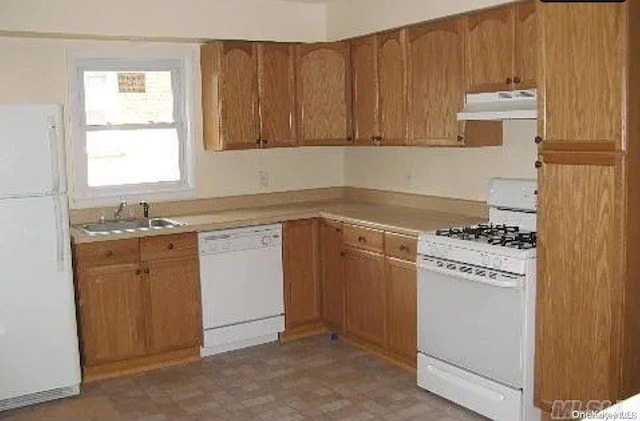 kitchen featuring white appliances and sink