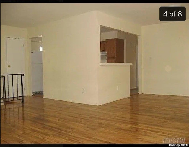 unfurnished room featuring hardwood / wood-style floors