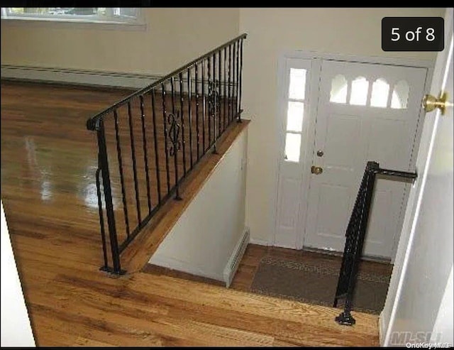 foyer entrance featuring dark hardwood / wood-style floors