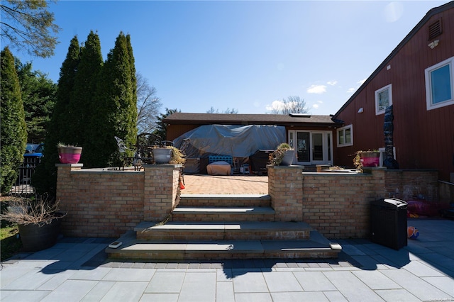 rear view of house featuring a patio area