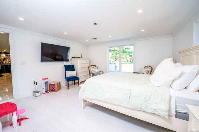 bedroom featuring access to exterior, light hardwood / wood-style floors, and ornamental molding