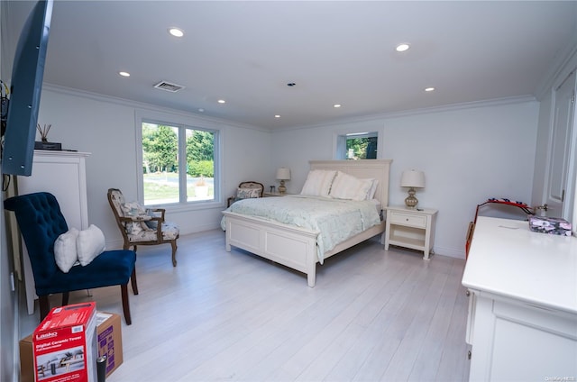 bedroom featuring light hardwood / wood-style floors and ornamental molding