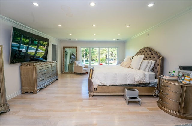 bedroom featuring light hardwood / wood-style floors and ornamental molding