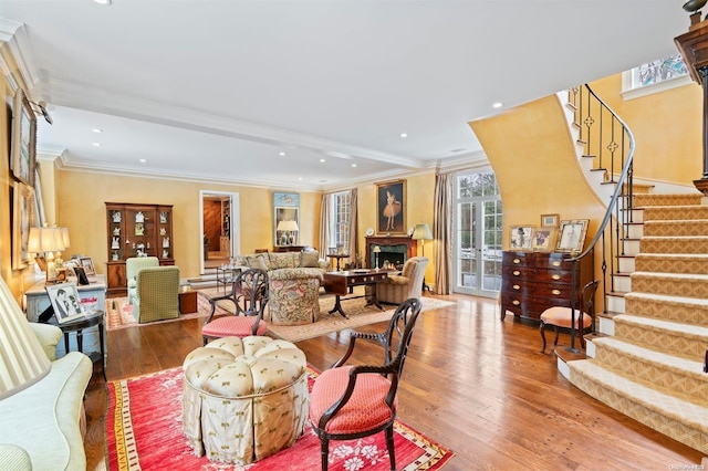 285 Piping Rock Rd, Locust Valley, NY 11560 - living room with wood finished floors, stairway, a lit fireplace, ornamental molding, and recessed lighting