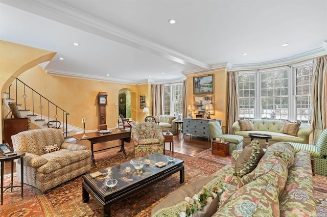 living room featuring beamed ceiling, wood-type flooring, and crown molding