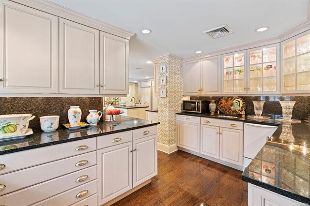 285 Piping Rock Rd, Locust Valley, NY 11560 - kitchen featuring stainless steel microwave, white cabinetry, dishwasher, tasteful backsplash, and glass insert cabinets