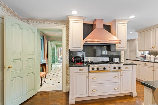 285 Piping Rock Rd, Locust Valley, NY 11560 - kitchen with custom range hood, stainless steel gas cooktop, dark countertops, tasteful backsplash, and dark wood-style flooring