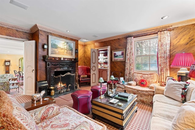 living room featuring ornamental molding and wood walls