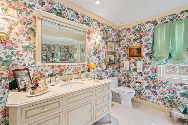 bathroom with tile patterned floors, toilet, vanity, and ornamental molding