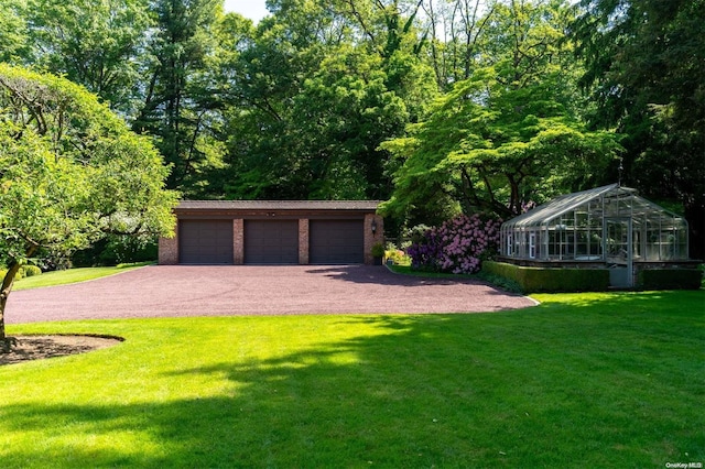 garage with a lawn