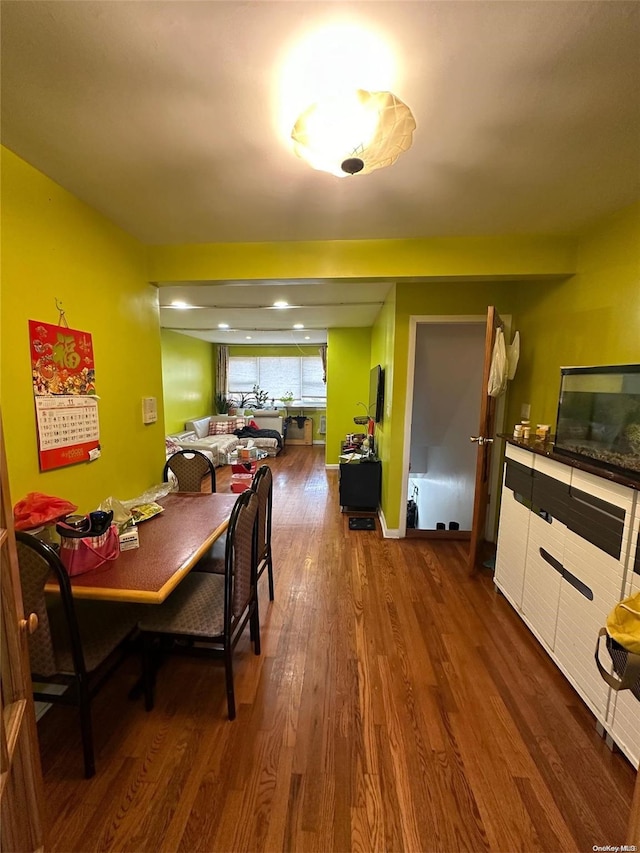 dining space featuring dark hardwood / wood-style flooring