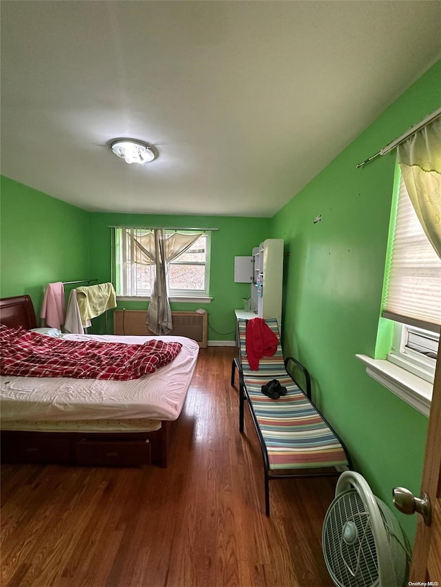 bedroom with wood-type flooring