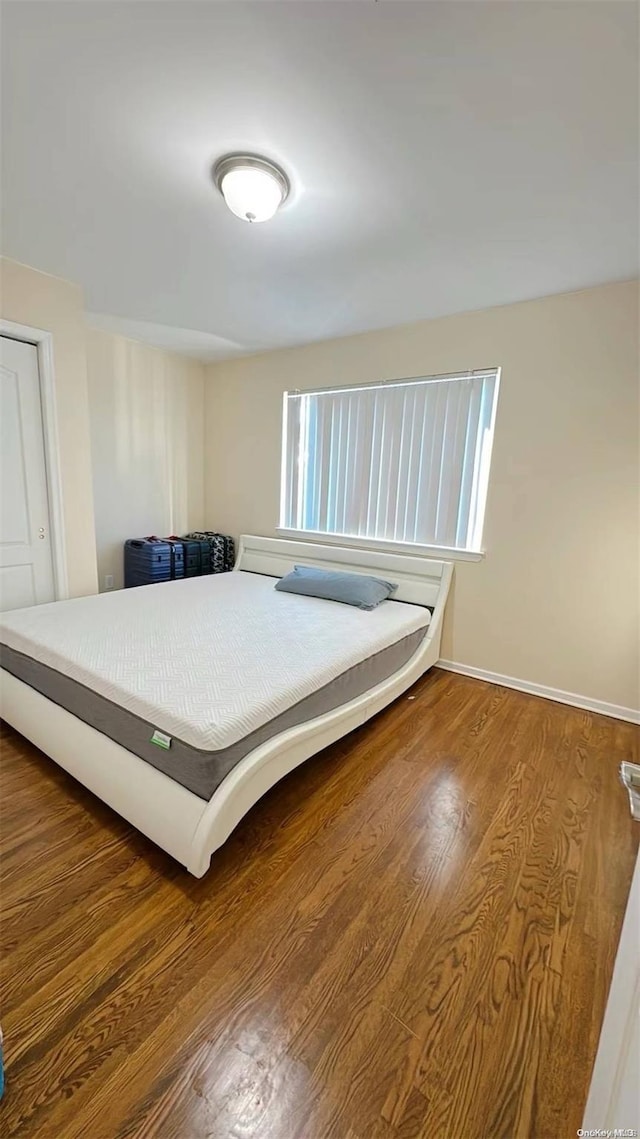 bedroom featuring wood-type flooring