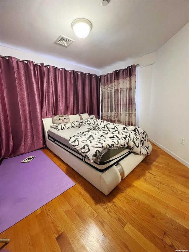 unfurnished bedroom featuring wood-type flooring