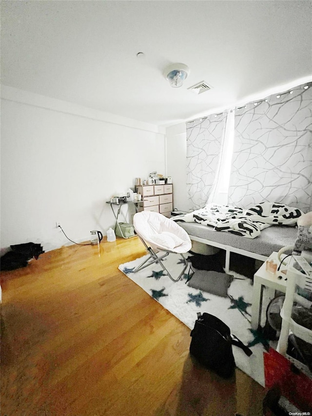 bedroom featuring hardwood / wood-style flooring