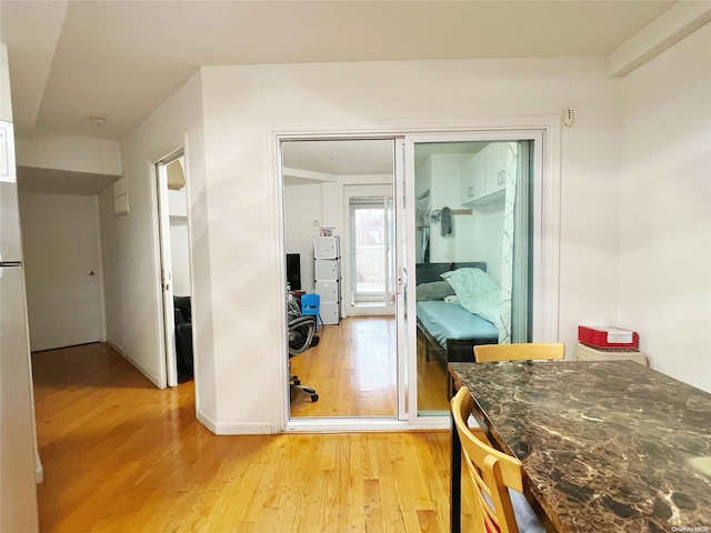 hall with light hardwood / wood-style floors