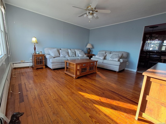 unfurnished living room featuring ceiling fan, ornamental molding, a baseboard heating unit, and hardwood / wood-style flooring