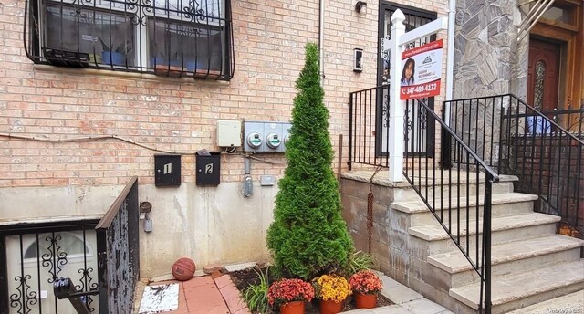 607 Ashford St, Brooklyn, NY 11207 - property entrance with brick siding