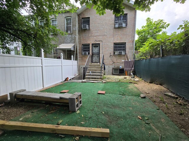 back of property with central AC unit