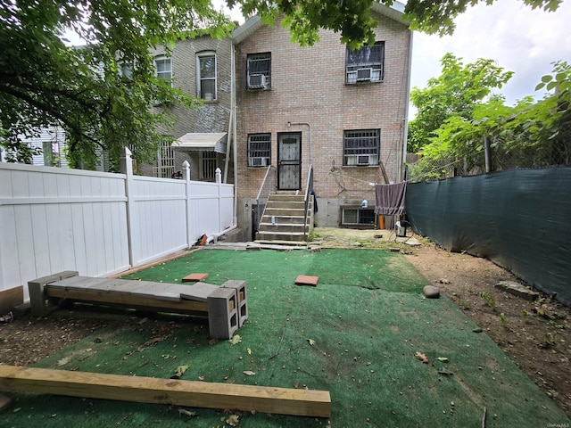 607 Ashford St, Brooklyn, NY 11207 - back of house featuring brick siding, central AC, and cooling unit