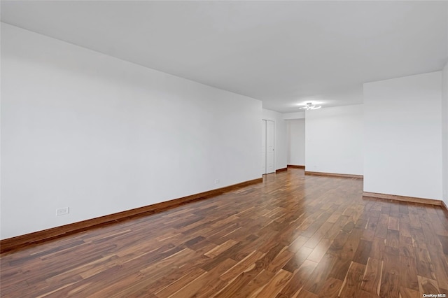 empty room featuring dark wood-type flooring