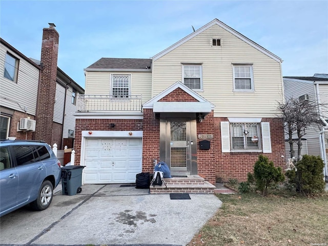 view of front of house featuring a garage and a balcony