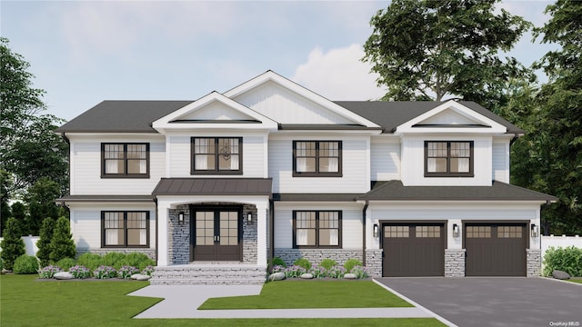 view of front of property with a garage and a front yard