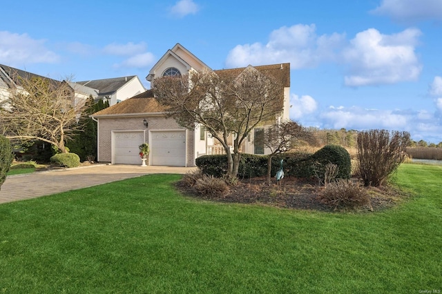 view of front facade featuring a garage and a front lawn