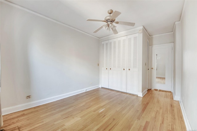 unfurnished bedroom featuring a closet, light hardwood / wood-style floors, ceiling fan, and ornamental molding