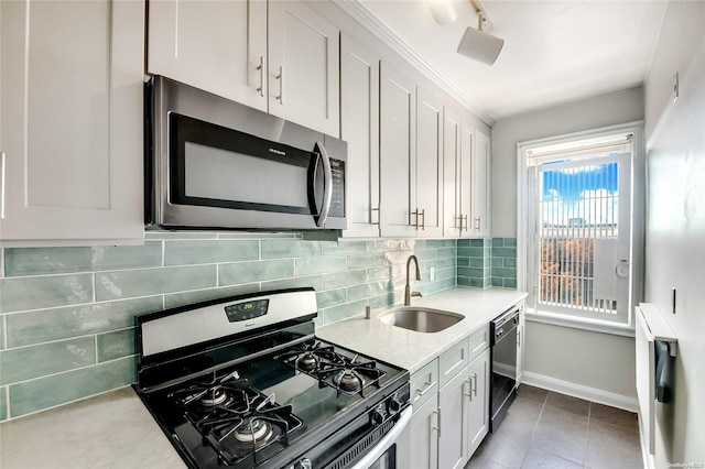 kitchen with black appliances, tile patterned flooring, white cabinetry, and sink