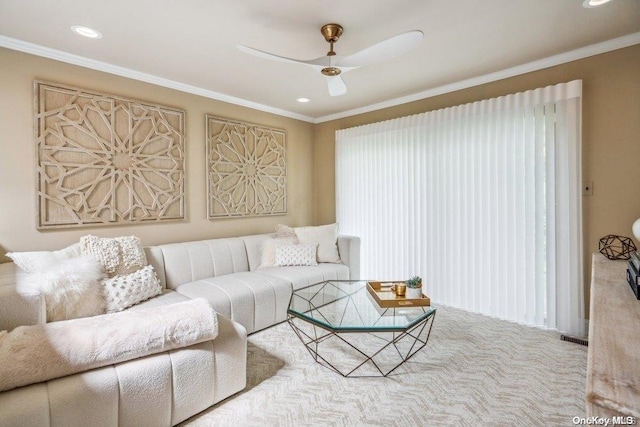 living room featuring carpet flooring, ceiling fan, and crown molding