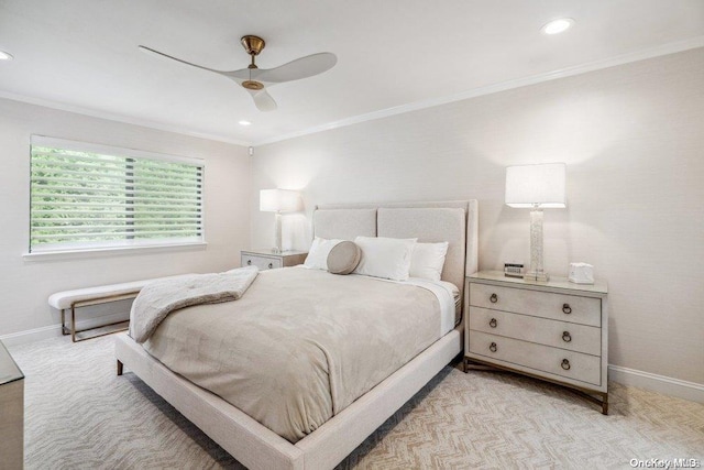 carpeted bedroom with ceiling fan and ornamental molding