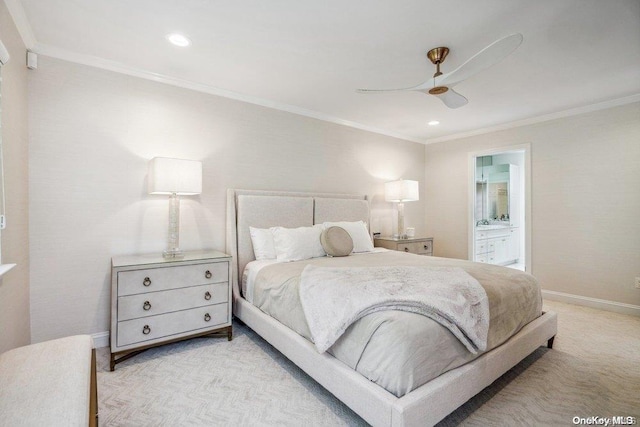 bedroom featuring ceiling fan, crown molding, light colored carpet, and ensuite bathroom