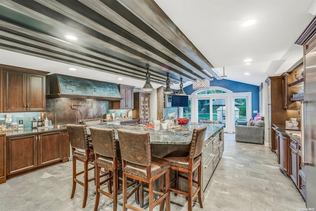 dining room with french doors and vaulted ceiling with beams