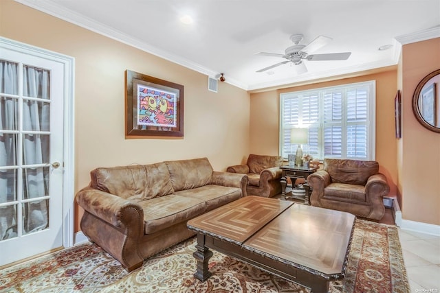 tiled living room featuring ceiling fan and ornamental molding