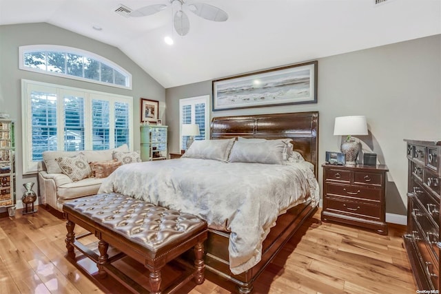 bedroom featuring ceiling fan, light wood-type flooring, and vaulted ceiling