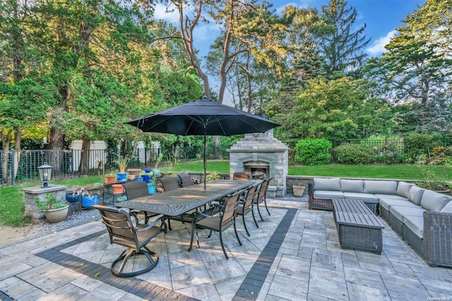 view of patio / terrace featuring an outdoor living space with a fireplace