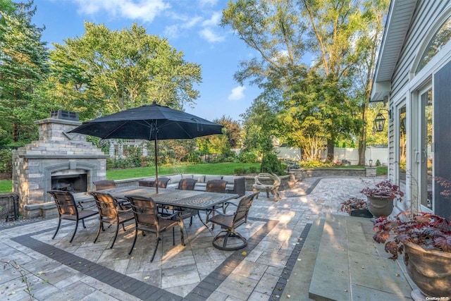 view of patio / terrace with an outdoor fireplace