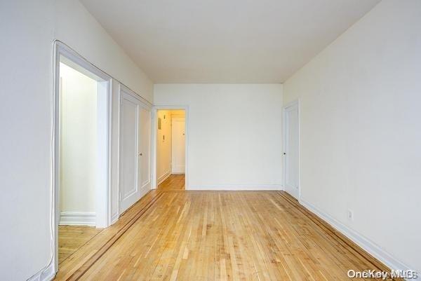 unfurnished room with light hardwood / wood-style flooring