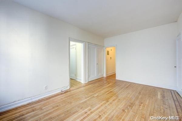 unfurnished room with light hardwood / wood-style floors