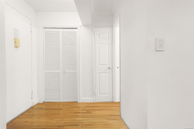 corridor featuring light hardwood / wood-style floors