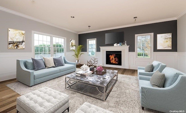 living room featuring hardwood / wood-style flooring and ornamental molding