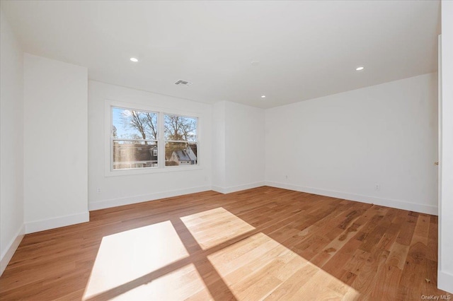 unfurnished room with light hardwood / wood-style flooring