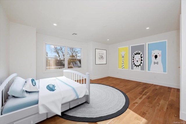 bedroom featuring hardwood / wood-style floors