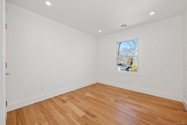 spare room featuring hardwood / wood-style flooring