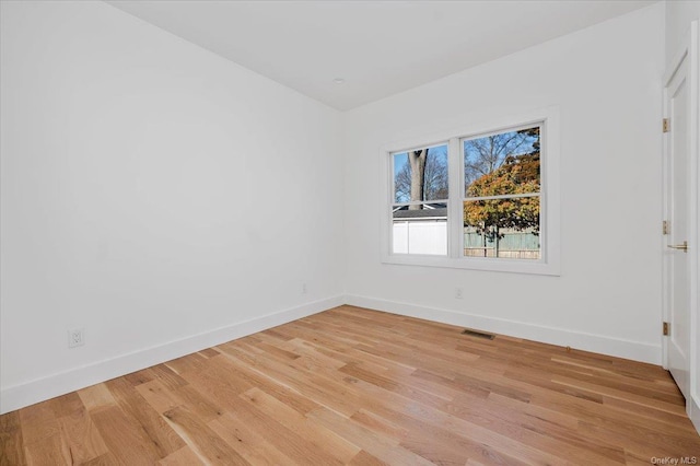 spare room with light wood-type flooring