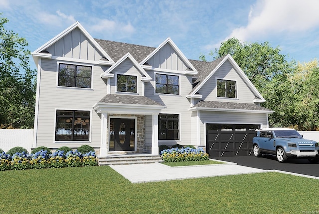 view of front of house featuring a front yard, driveway, roof with shingles, an attached garage, and board and batten siding