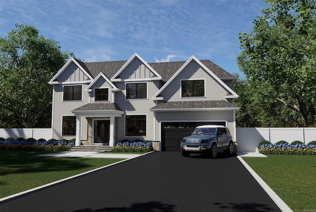 view of front of house featuring fence, driveway, a front lawn, a garage, and board and batten siding