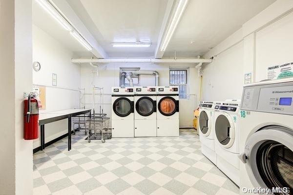 laundry room with independent washer and dryer